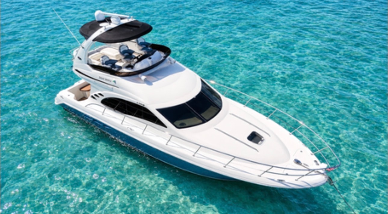 "BLUE" Sea Ray 50GT aerial overhead view turquoise water