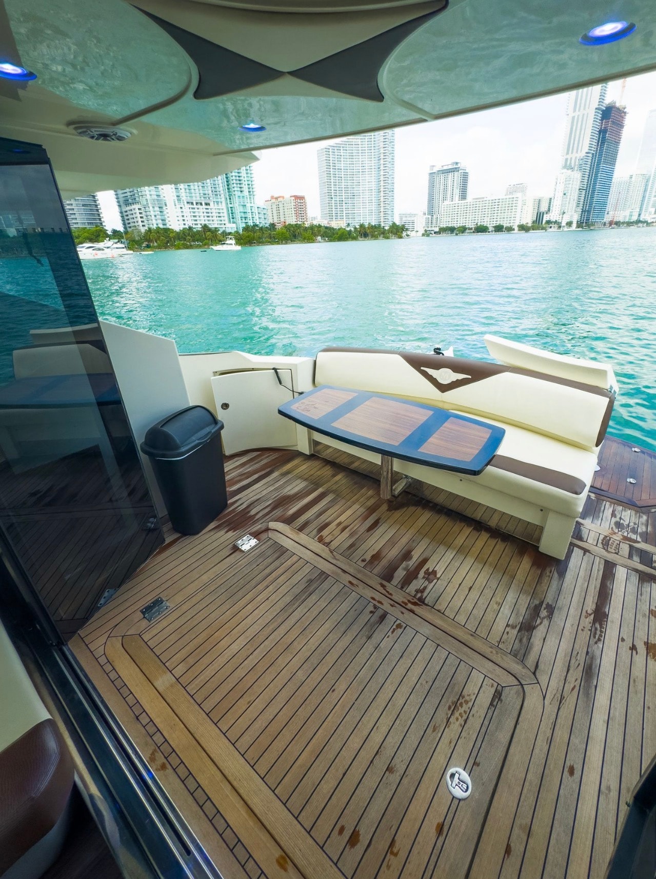 Marquis Sport Coupe 42ft aft deck teak seating with Miami skyline view