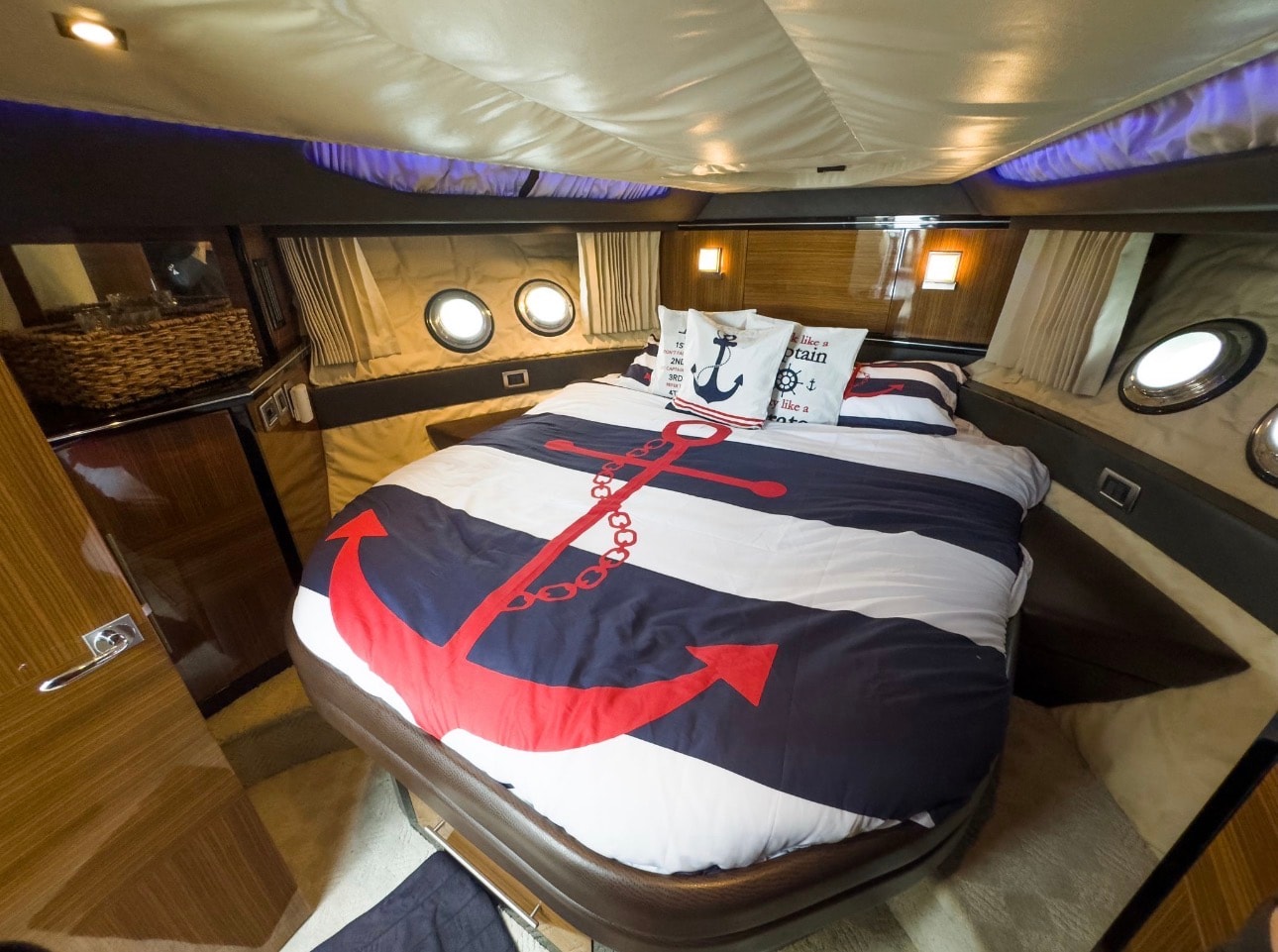 Marquis Sport Coupe 42ft master stateroom with nautical bedding