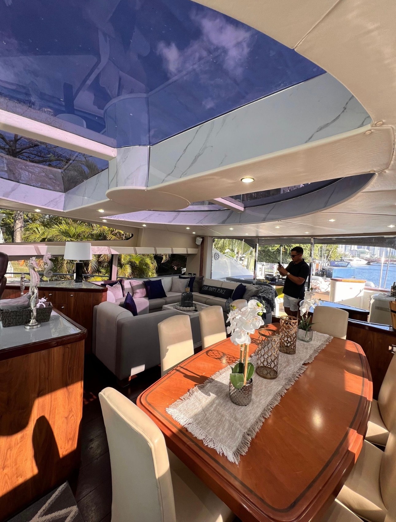 PREDATOR 82ft Sunseeker aft deck seating with Brickell skyline at golden hour