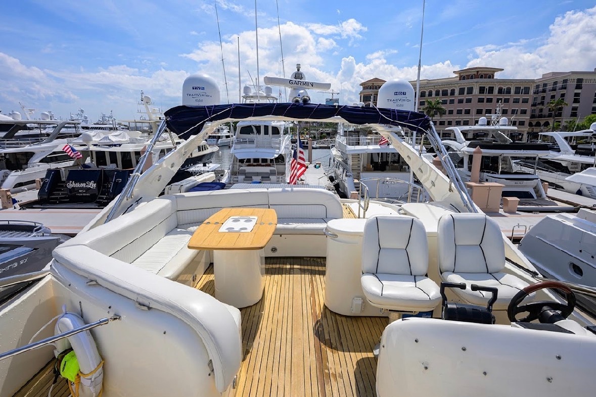 Sunseeker 88ft flybridge helm and lounge seating at luxury marina — Sunseeker yacht rental Miami