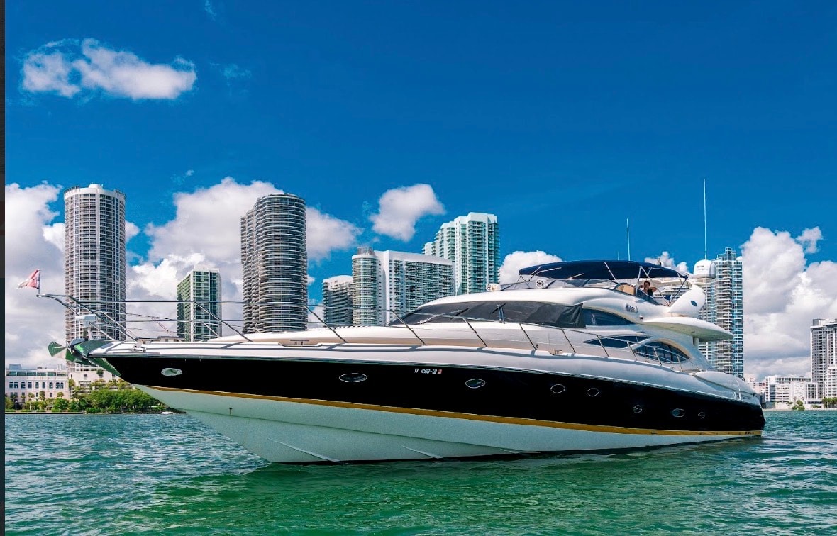 Sunseeker 88ft yacht profile view with Miami skyline — 88ft yacht rental Miami